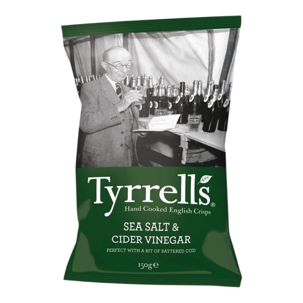 A green packet of Tyrrells hand cooked English crisps featuring a black and white vintage photograph of a man in glasses examining bottles, with sea salt and cider vinegar flavour branding and 150g weight displayed.