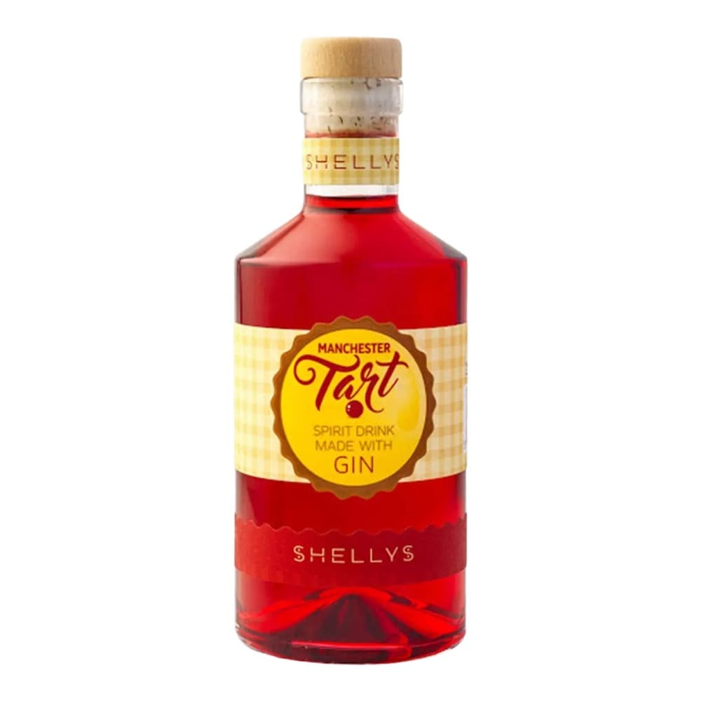 A bottle of Shellys Manchester Tart spirit drink made with gin, featuring a red liquid and a yellow label with brown detailing, photographed against a white background.
