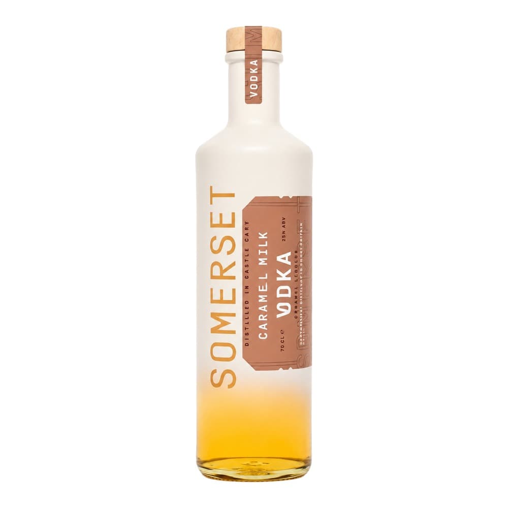 A bottle of Somerset Caramel Milk Vodka with a natural wood and cream label on a plain white background, showing golden caramel-coloured liquid inside.