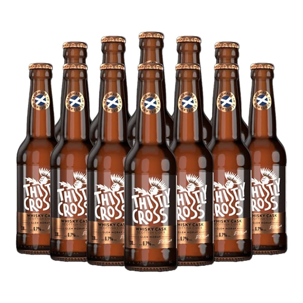 Seven amber glass bottles of Thistle Cross Whisky Cask cider arranged in rows against a white background, each with a gold foil cap and white thistle logo label