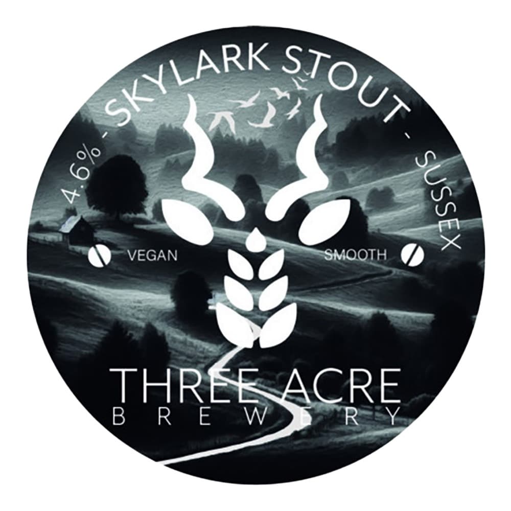 Circular beer label for Skylark Stout by Three Acre Brewery, featuring a stylised deer skull logo and moody landscape background, indicating 4.6% alcohol and vegan, smooth, and Sussex characteristics.