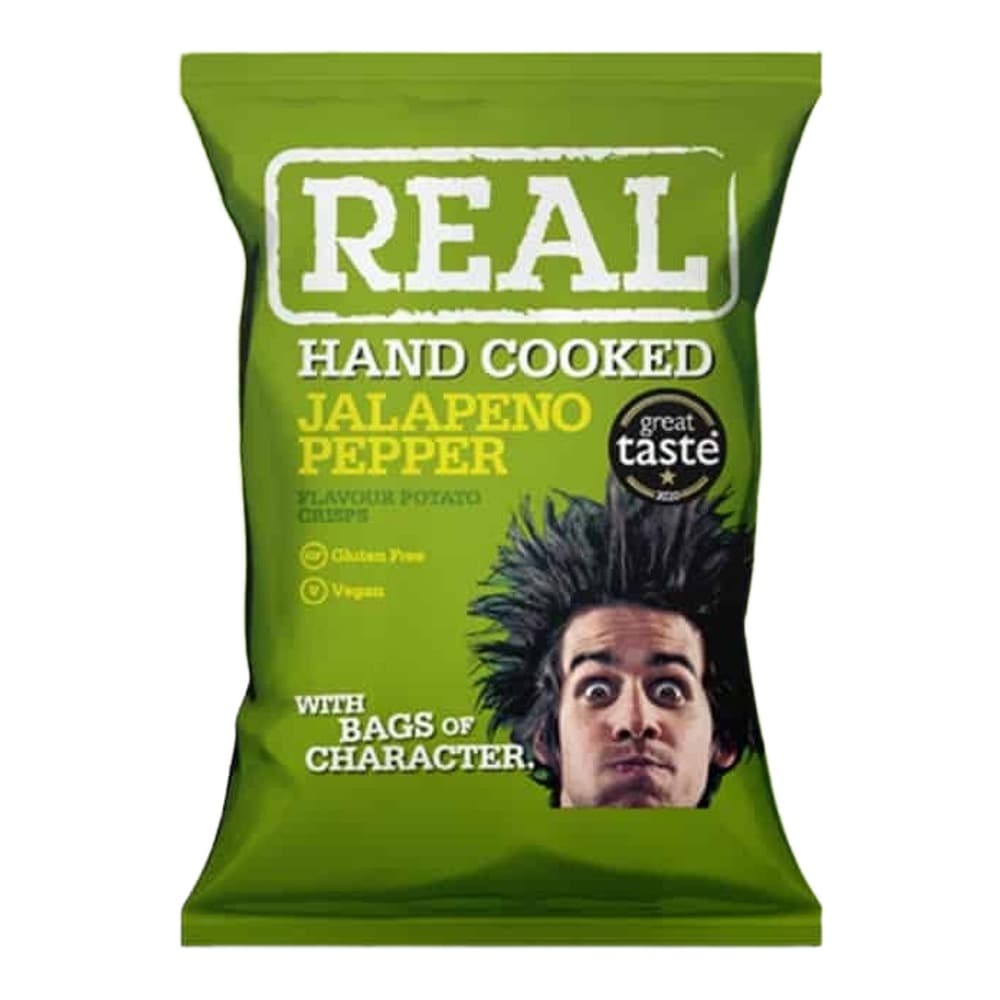Green packet of Real brand hand cooked jalapeño pepper flavoured potato crisps with a man's face and spiky hair, featuring Great Taste award badge, against a green and white background.