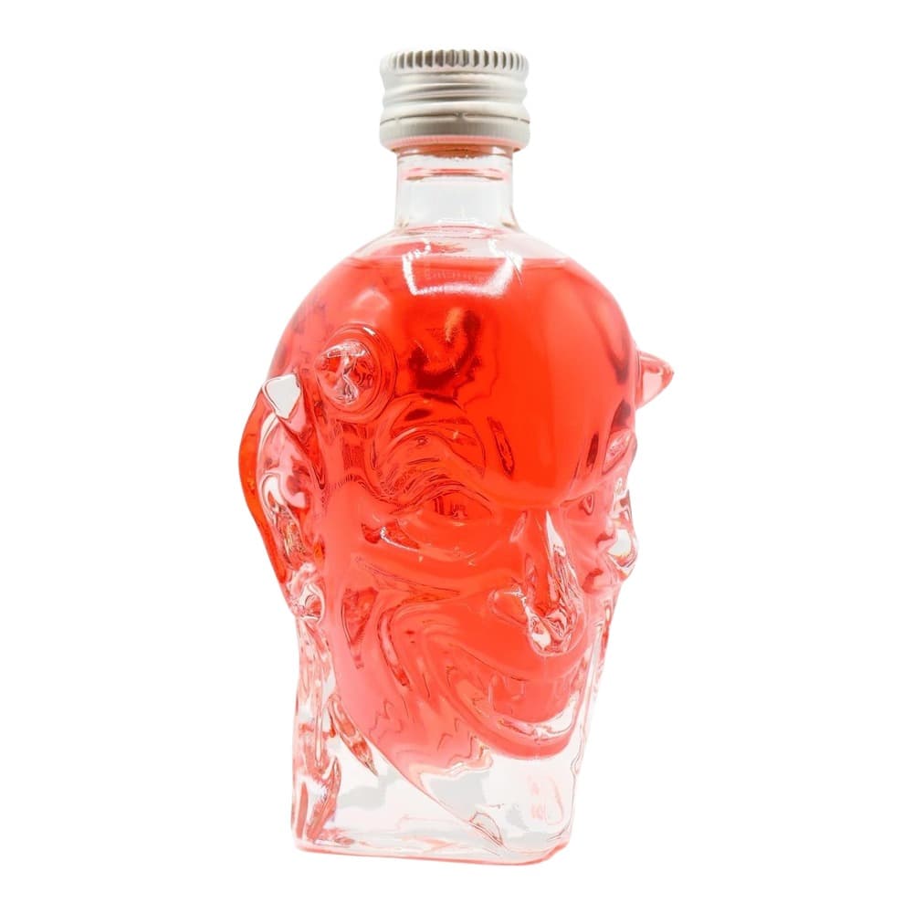 A decorative glass bottle filled with vibrant red liquid, featuring an ornate embossed head design on the front and a metallic screw-top cap, photographed against a white background.