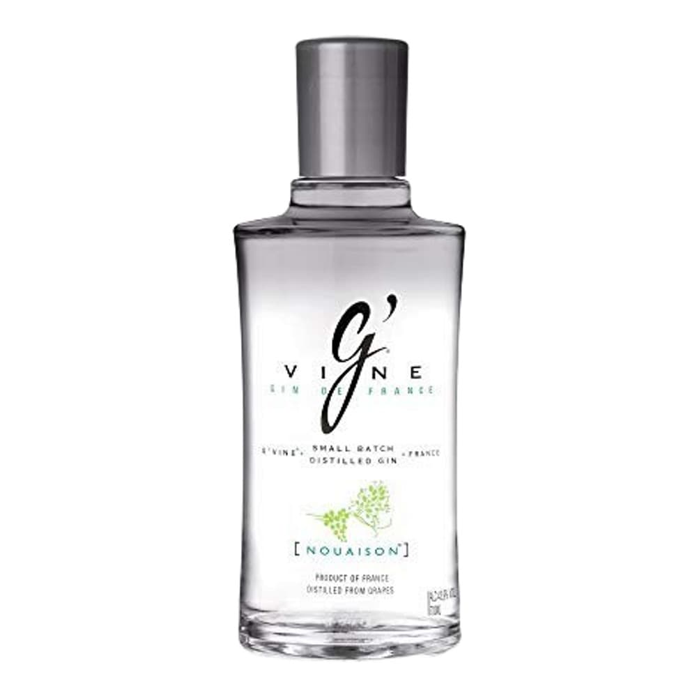 A clear glass bottle of G'Vine gin with a grey metal cap, featuring a minimalist label with grape illustration on a white background.