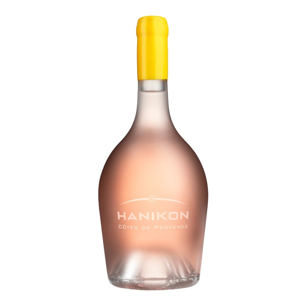 A bottle of Hanikon Côtes de Provence rosé wine with a yellow capsule on a white background.