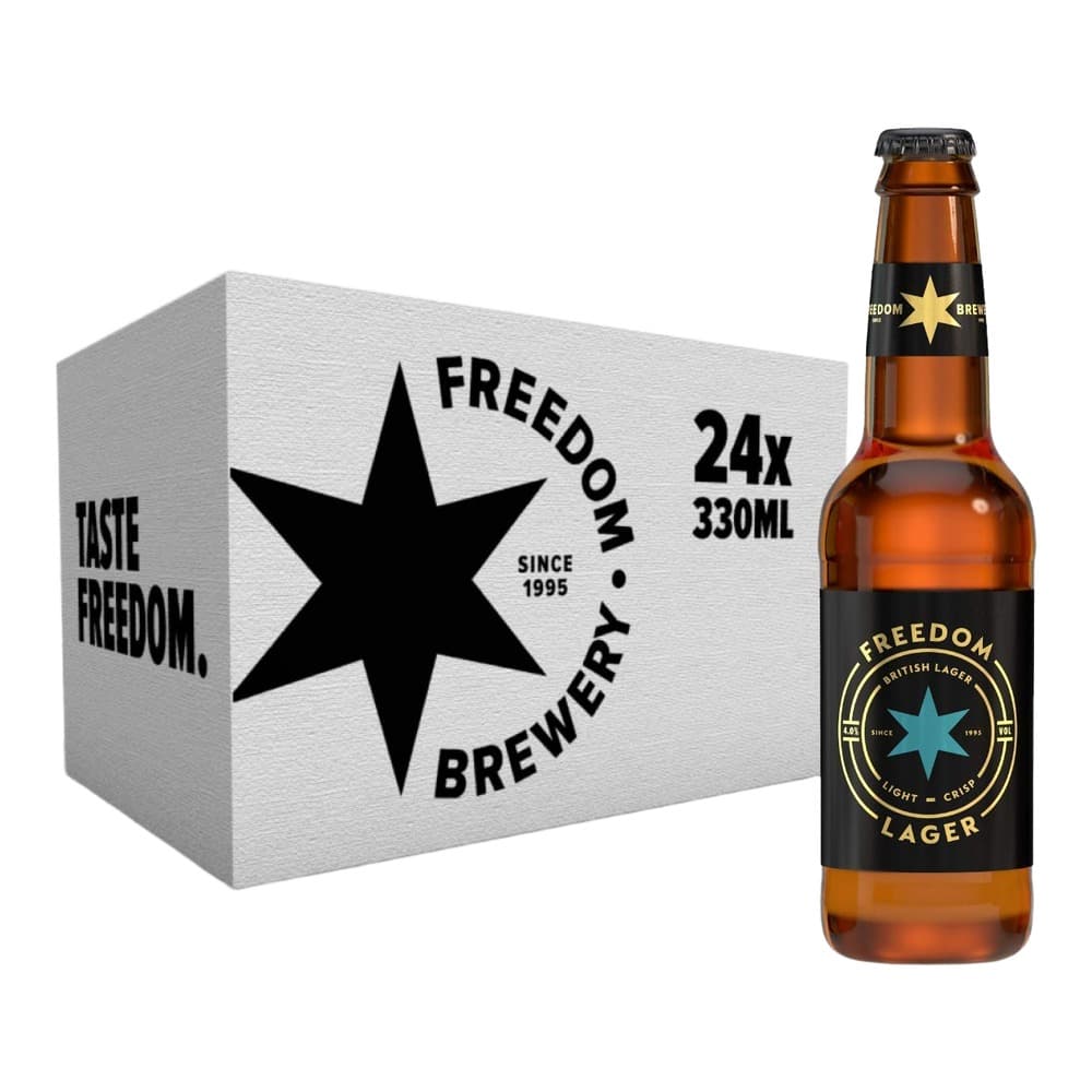 A case box and single bottle of Freedom Brewery Lager beer, featuring a black star logo and gold labelling on amber glass bottle against white background.