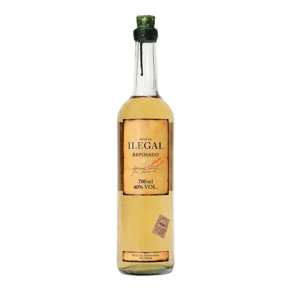 Bottle of Illegal Mezcal Reposado against a white background, featuring a pale golden-coloured spirit at 40% ABV in a 700ml glass bottle with a green cap and cork.